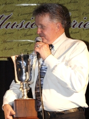 Whisperin\' Bill Anderson with an award for Jimmy Dean