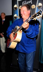 William Shatner clowns around with a special painted guitar presented to him by Gibson and Mandy Lawson