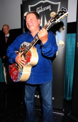 William Shatner clowns around with a special painted guitar presented to him by Gibson and Mandy Lawson