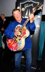 William Shatner clowns around with a special painted guitar presented to him by Gibson and Mandy Lawson