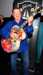 William Shatner clowns around with a special painted guitar presented to him by Gibson and Mandy Lawson