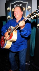 William Shatner clowns around with a special painted guitar presented to him by Gibson and Mandy Lawson